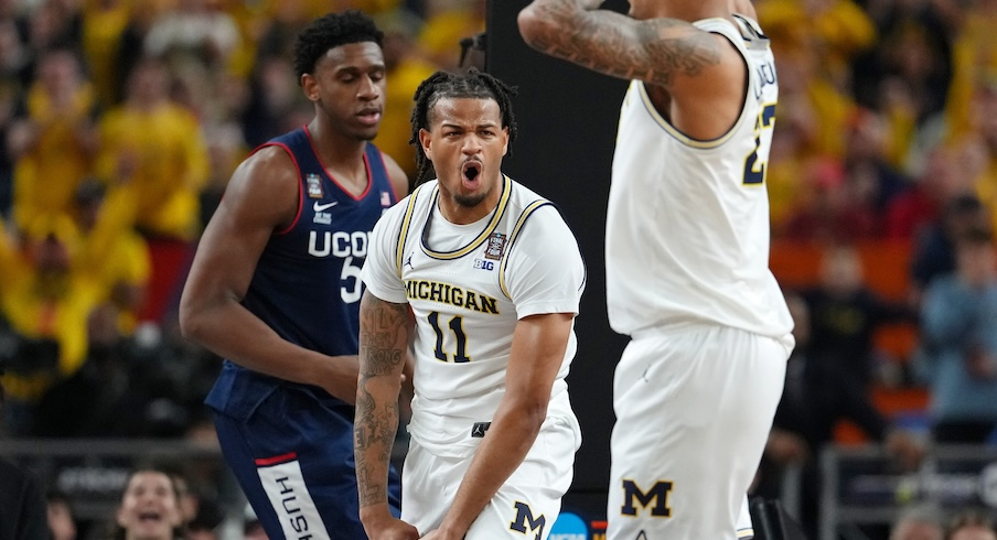 Roddy Gayle playing for Michigan in a basketball game